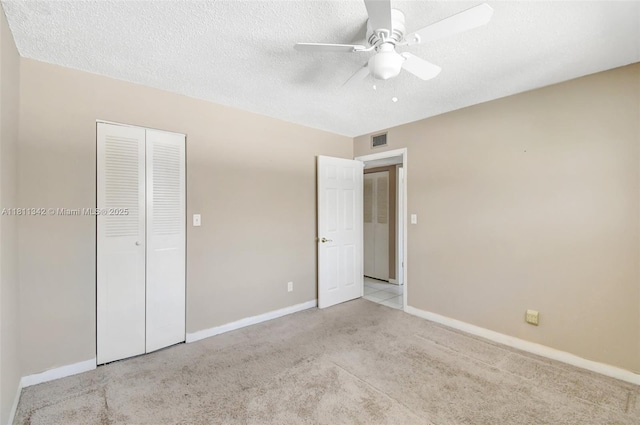 6211 SW 37th St Unit 211, Davie, FL 33314 - unfurnished bedroom featuring carpet floors, a closet, baseboards, ceiling fan, and a textured ceiling