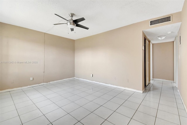 6211 SW 37th St Unit 211, Davie, FL 33314 - empty room with ceiling fan, light tile patterned floors, a textured ceiling, and baseboards