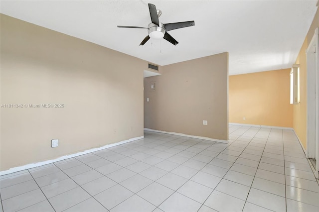 6211 SW 37th St Unit 211, Davie, FL 33314 - spare room featuring a ceiling fan, light tile patterned floors, and baseboards