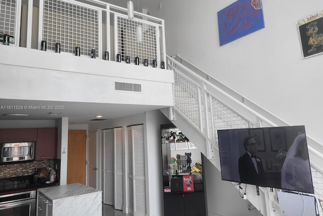 244 Biscayne Blvd Unit 644, Miami, FL 33132 - stairs featuring a high ceiling
