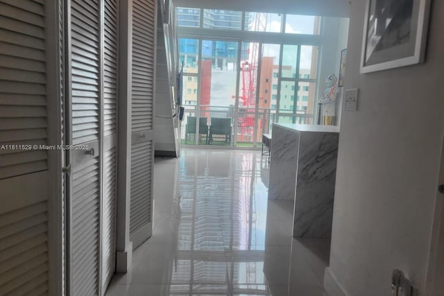 244 Biscayne Blvd Unit 644, Miami, FL 33132 - hallway with a view of city and tile patterned floors