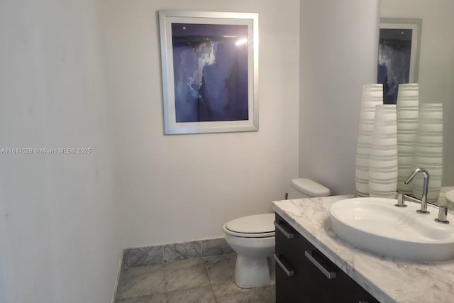 244 Biscayne Blvd Unit 644, Miami, FL 33132 - bathroom featuring vanity, toilet, and baseboards