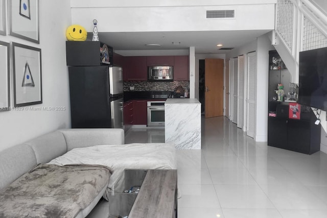 244 Biscayne Blvd Unit 644, Miami, FL 33132 - living room featuring light tile patterned floors and recessed lighting