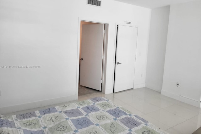 244 Biscayne Blvd Unit 644, Miami, FL 33132 - unfurnished bedroom with light tile patterned floors and baseboards