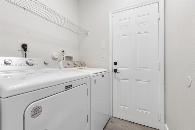 24083 SW 112th Pl, Homestead, FL 33032 - laundry area with washing machine and clothes dryer and light wood-style flooring