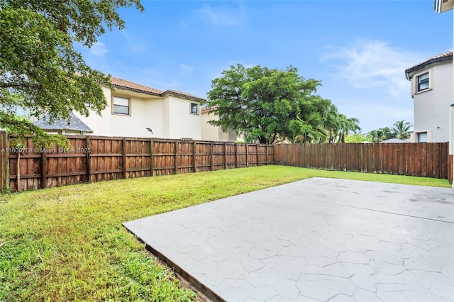 24083 SW 112th Pl, Homestead, FL 33032 - fenced backyard with a patio area