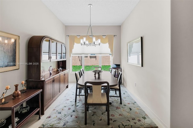 7059 Copperfield Cir, Lake Worth, FL 33467 - dining space featuring a chandelier, a textured ceiling, baseboards, and light colored carpet