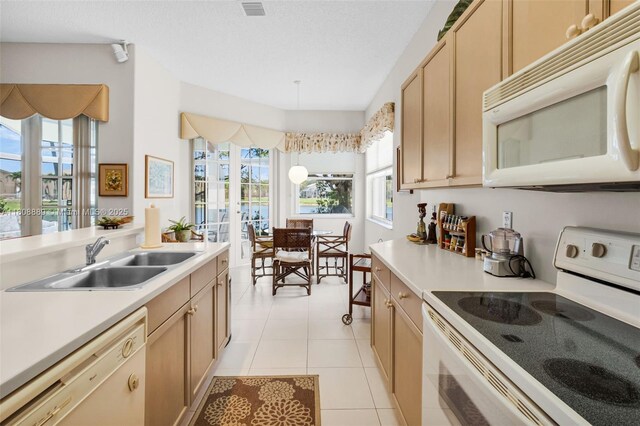 7059 Copperfield Cir, Lake Worth, FL 33467 - kitchen with white appliances, a sink, light countertops, and light tile patterned floors