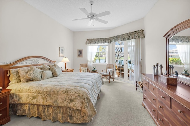 7059 Copperfield Cir, Lake Worth, FL 33467 - bedroom featuring light carpet, access to exterior, and a ceiling fan
