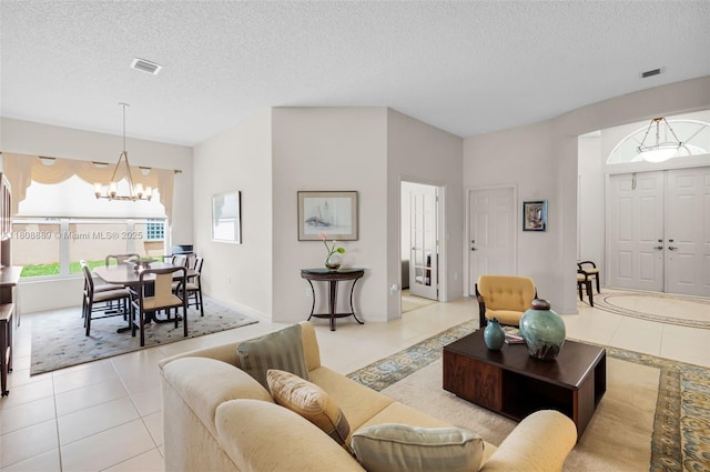 7059 Copperfield Cir, Lake Worth, FL 33467 - living room with a chandelier, healthy amount of natural light, light tile patterned flooring, and a textured ceiling