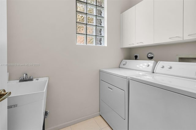 7059 Copperfield Cir, Lake Worth, FL 33467 - washroom featuring independent washer and dryer, cabinet space, and light tile patterned floors