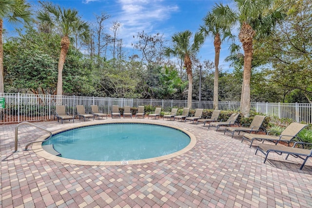 7059 Copperfield Cir, Lake Worth, FL 33467 - community pool with a patio area and view of scattered trees