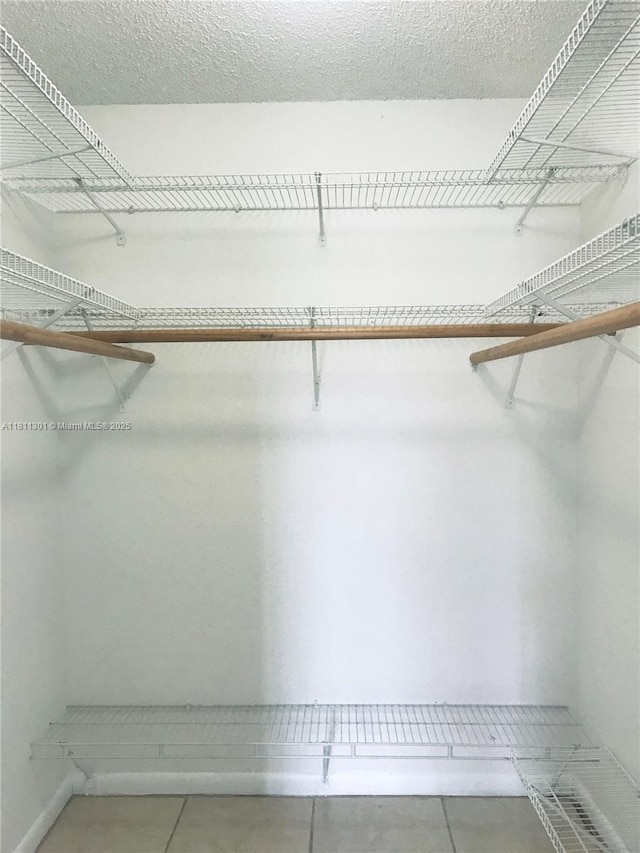17600 NW 68th Ave Unit B3006, Hialeah, FL 33015 - walk in closet with tile patterned flooring