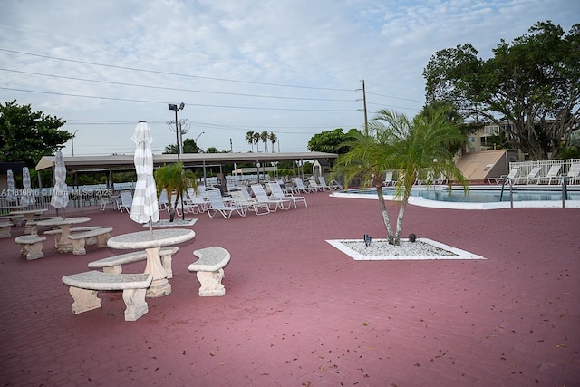 2861 NW 47th Ter Unit 201A, Lauderdale Lakes, FL 33313 - view of community with a swimming pool and a patio