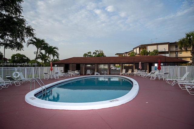 2861 NW 47th Ter Unit 201A, Lauderdale Lakes, FL 33313 - community pool with a patio