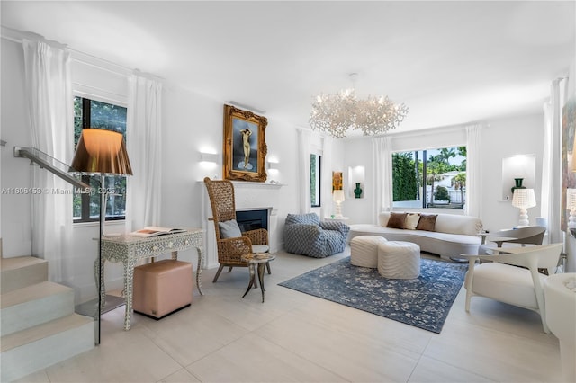 5970 Alton Rd, Miami Beach, FL 33140 - living area with stairs, a chandelier, a fireplace, and tile patterned floors