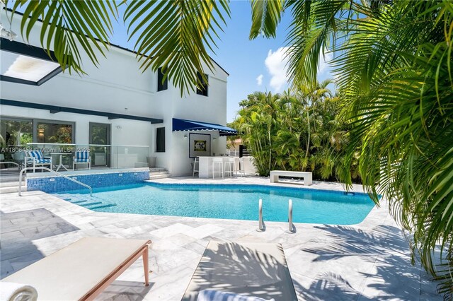 5970 Alton Rd, Miami Beach, FL 33140 - outdoor pool featuring a patio and an outdoor bar