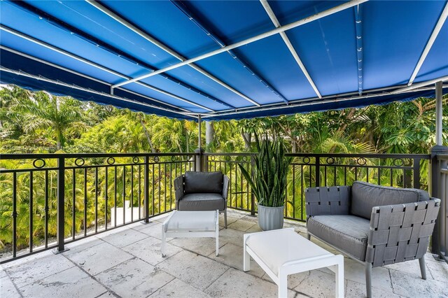 5970 Alton Rd, Miami Beach, FL 33140 - view of patio / terrace featuring a balcony and an outdoor living space