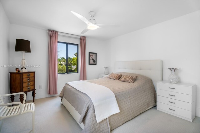 5970 Alton Rd, Miami Beach, FL 33140 - bedroom with light colored carpet and ceiling fan