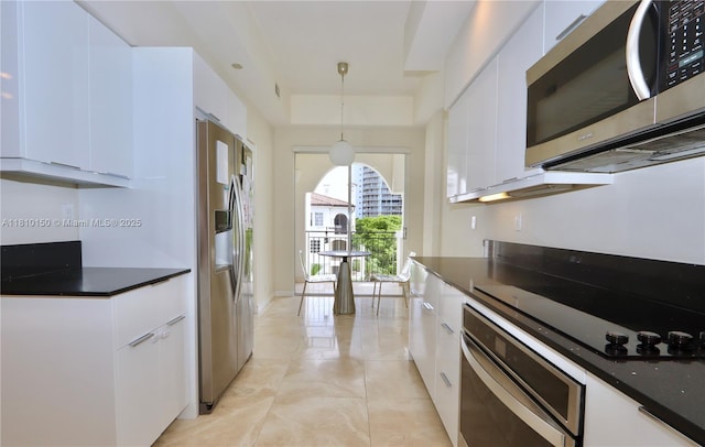 3900 Island Bl Ph 2, Aventura, FL 33160 - kitchen featuring appliances with stainless steel finishes, dark countertops, modern cabinets, and white cabinetry