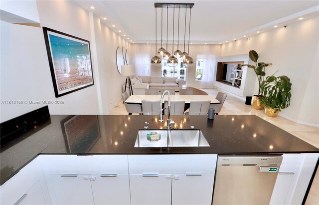 3900 Island Bl Ph 2, Aventura, FL 33160 - kitchen featuring stainless steel dishwasher, open floor plan, a sink, white cabinets, and dark stone counters