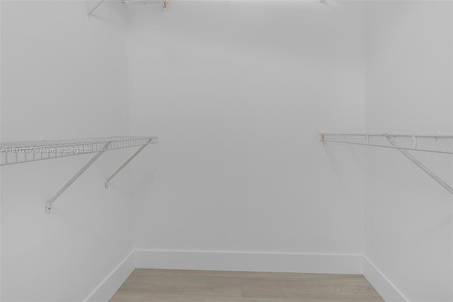 12154 Saint Andrews Pl Unit 112, Miramar, FL 33025 - spacious closet with light wood-style flooring
