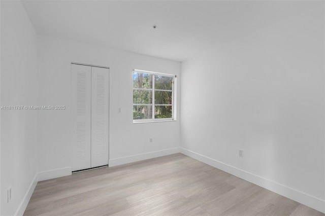 12154 Saint Andrews Pl Unit 112, Miramar, FL 33025 - unfurnished room featuring light wood-type flooring and baseboards