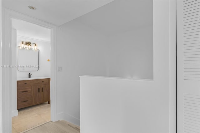 12154 Saint Andrews Pl Unit 112, Miramar, FL 33025 - hallway featuring baseboards and a sink