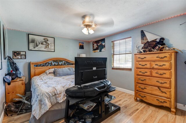 40691 Suzan Dr, Punta Gorda, FL 33982 - bedroom with light wood finished floors, baseboards, and a ceiling fan