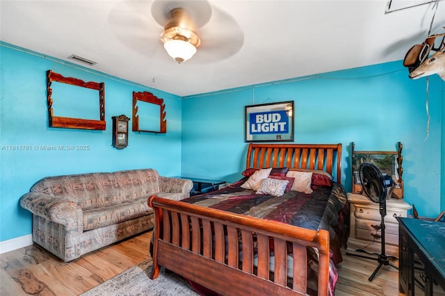 40691 Suzan Dr, Punta Gorda, FL 33982 - bedroom featuring wood finished floors, a ceiling fan, and baseboards