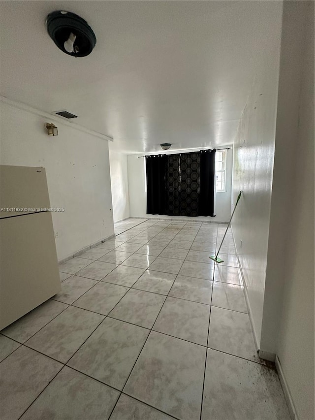 315 W 44th St, Hialeah, FL 33012 - corridor featuring light tile patterned flooring