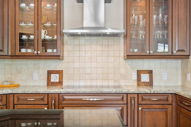 20120 SW 133rd Ave, Miami, FL 33177 - kitchen featuring wall chimney exhaust hood, glass insert cabinets, brown cabinets, and light stone countertops