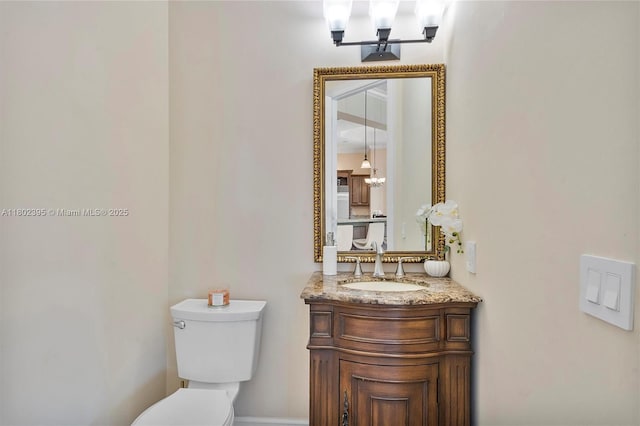 20120 SW 133rd Ave, Miami, FL 33177 - bathroom with toilet, vanity, and a chandelier