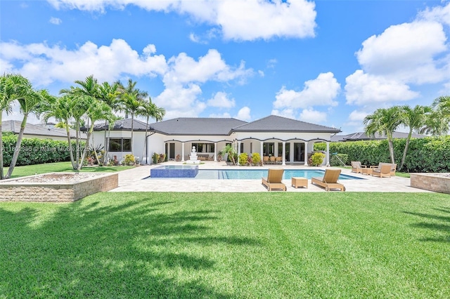 20120 SW 133rd Ave, Miami, FL 33177 - back of house with a patio, a lawn, stucco siding, and a pool with connected hot tub