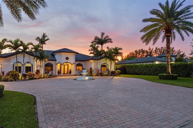 20120 SW 133rd Ave, Miami, FL 33177 - mediterranean / spanish-style house with curved driveway and stucco siding