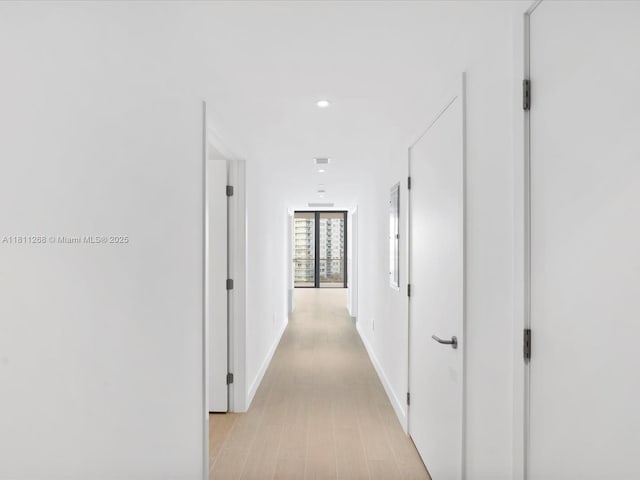 500 Alton Rd Unit 805, Miami Beach, FL 33139 - corridor featuring light wood-type flooring, recessed lighting, and baseboards