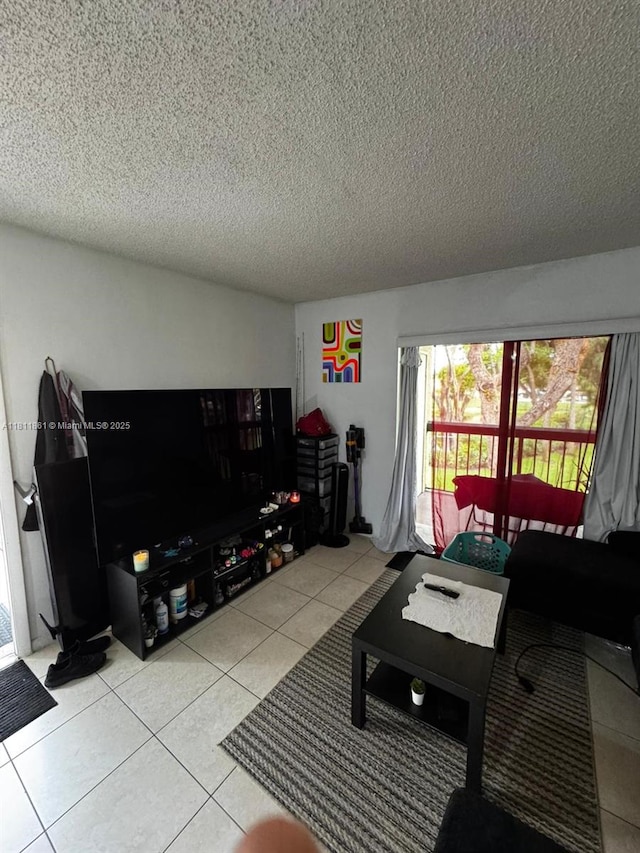 6023 10th Ave N Unit 215, Green Acres, FL 33463 - living area featuring light tile patterned floors, plenty of natural light, and a textured ceiling