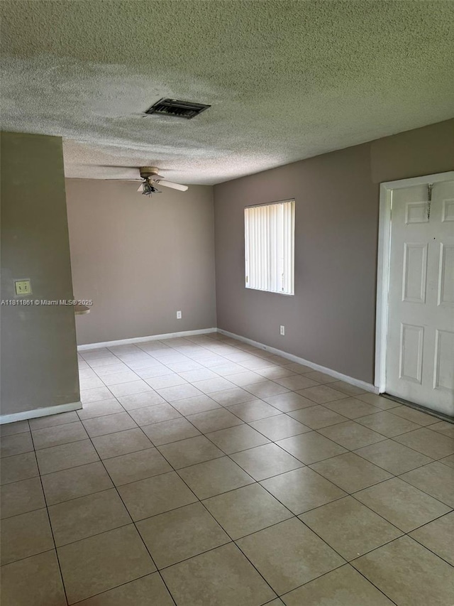 6023 10th Ave N Unit 215, Green Acres, FL 33463 - spare room with ceiling fan, a textured ceiling, and light tile patterned floors