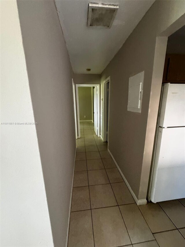 6023 10th Ave N Unit 215, Green Acres, FL 33463 - hall featuring light tile patterned floors and electric panel