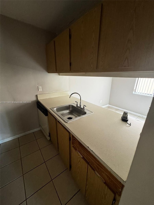 6023 10th Ave N Unit 215, Green Acres, FL 33463 - kitchen with dishwasher, light tile patterned flooring, and light countertops