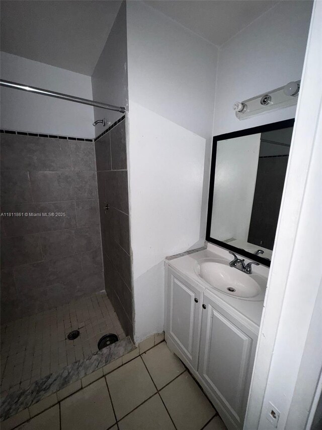 6023 10th Ave N Unit 215, Green Acres, FL 33463 - bathroom with a shower stall, tile patterned floors, and vanity