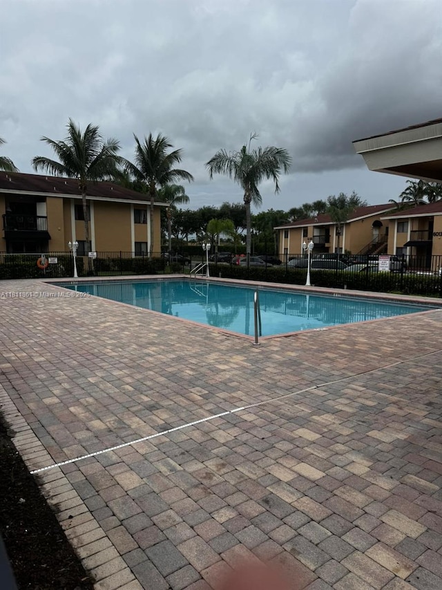 6023 10th Ave N Unit 215, Green Acres, FL 33463 - community pool with a patio