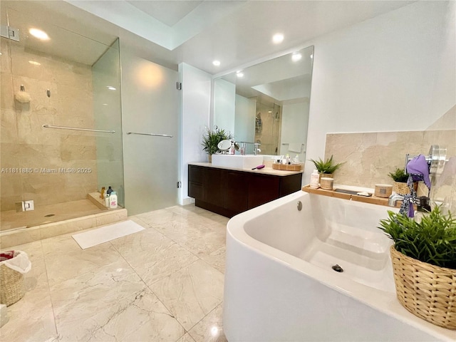 250 Sunny Isles Blvd Unit 3-602, Sunny Isles Beach, FL 33160 - bathroom featuring a soaking tub, vanity, tiled shower, and recessed lighting