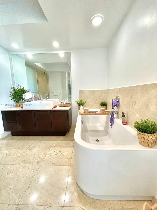 250 Sunny Isles Blvd Unit 3-602, Sunny Isles Beach, FL 33160 - bathroom featuring vanity, a garden tub, marble finish flooring, and recessed lighting