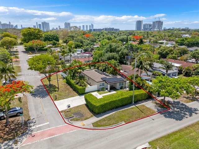 17491 NE 19th Ave, North Miami Beach, FL 33162 - aerial view of property and surrounding area featuring city skyline and property parcel outlined