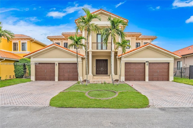 19347 SW 79th Pl, Cutler Bay, FL 33157 - mediterranean / spanish home with a balcony, decorative driveway, stucco siding, and a garage