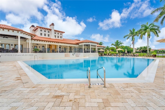 19347 SW 79th Pl, Cutler Bay, FL 33157 - community pool featuring a ceiling fan and a patio area