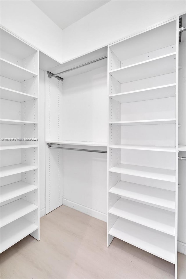 19347 SW 79th Pl, Cutler Bay, FL 33157 - spacious closet featuring light wood finished floors