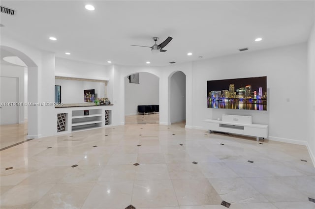 19347 SW 79th Pl, Cutler Bay, FL 33157 - unfurnished living room featuring arched walkways, recessed lighting, ceiling fan, baseboards, and tile patterned flooring