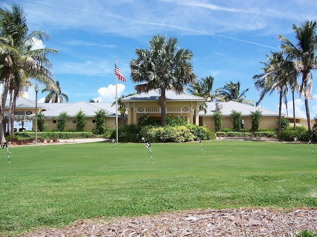 2862 W Crosley Dr Unit C, West Palm Beach, FL 33415 - view of front of home featuring a putting green and stucco siding